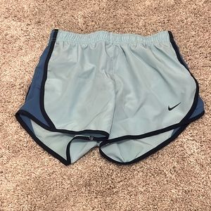 Light and dark blue nike athletic shorts.